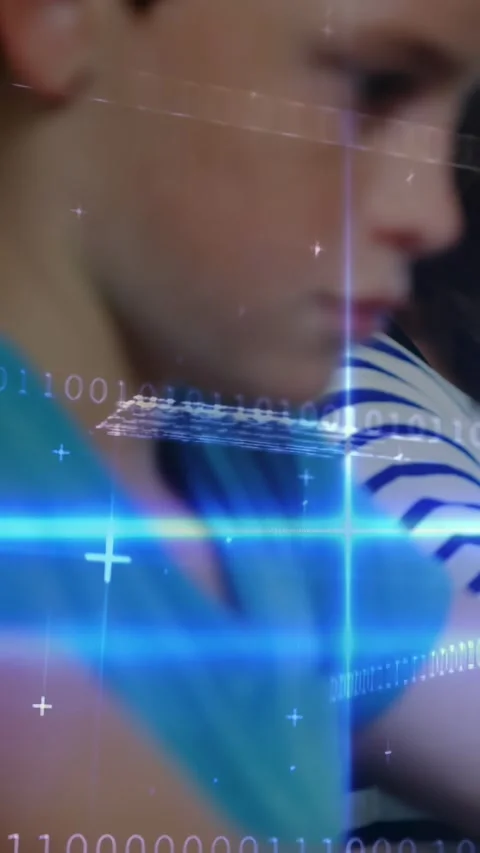 Boy sitting in profile tapping tablet, binary code streaks scrolling, children Stock Footage 331238257