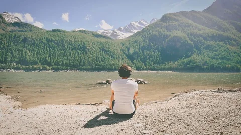A boy sitting in the sand Stock Footage 110738081
