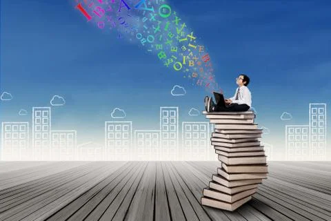 Boy sitting on stack of books with laptop Ilustración de archivo