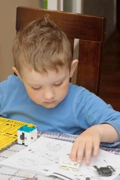 Boy sitting at the table Stock Photos