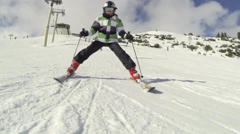 Boy skier overriding camera slow motion Stock Footage 34991775