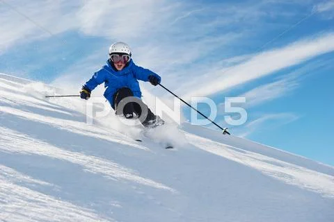 Boy Skiing On Snowy Mountainside