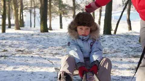 Boy sledding on snow. Active fun for family Christmas vacation Stock Footage 91179382