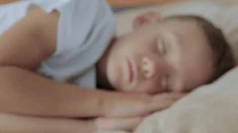 Boy is sleeping, a close-up of his face Stock Footage 172438306