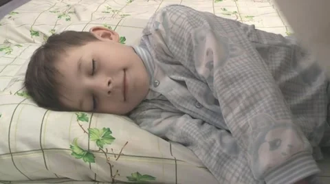 Boy sleeps in the nursery. Stock Footage 22075465