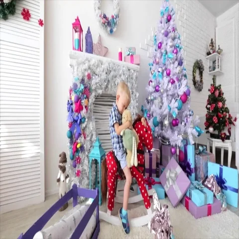 Boy sleeps. small boy sits in a baby horse. Christmas theme. Stock Footage 69532749