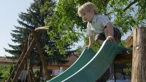 Boy Slide Thumbs Up - 4k - Slow motion Video stock 71485483