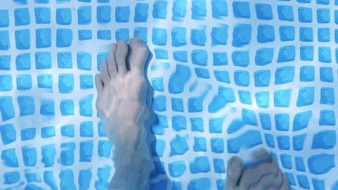 Boy slowly walks into the pool Video stock 131314056