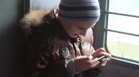 Boy with smartphone in the russian train Stock Footage 57508876