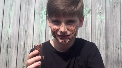 Boy smeared with chocolate cream Stock Footage 159613639