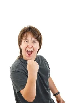 Boy smiling and confidently posing with fist up like success Stock Photos