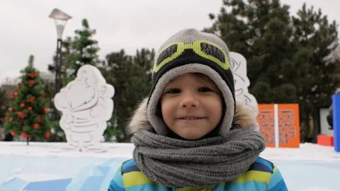 Boy smiling on the background of christmas trees. winter Stock Footage 99880035