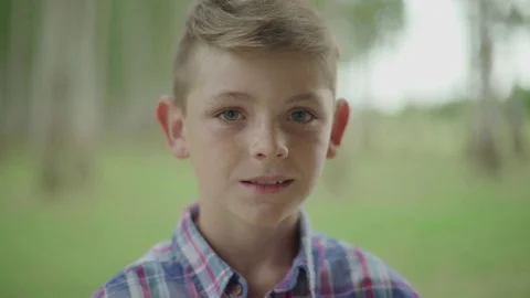 Boy smiling cheerfully, portrait Stock Footage 75190283