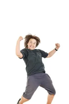 Boy smiling with face expression and jumping in black dark t-shirt Stock Photos