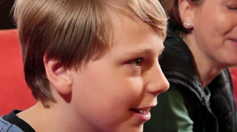 Boy smiling while playing on console with his mother Stock Footage 47682709