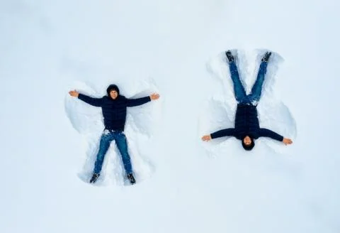 The boy on a snow angel shows, pattern Stock Photos