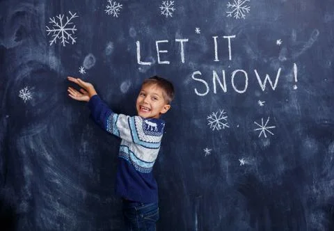 Boy with Snow in studio 写真素材