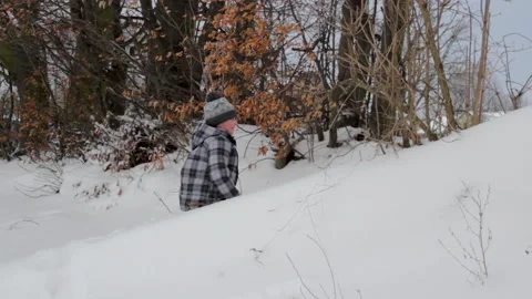 Boy in a snowdrift Stock Footage 148265339