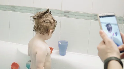 The boy is soaped at home Stock Footage 129682728