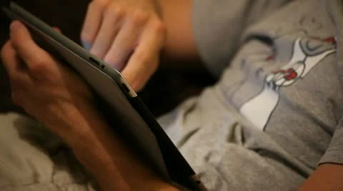 A boy on sofa with tablet Stock Footage 11235175
