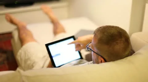A boy on sofa with tablet Stock Footage 11236055