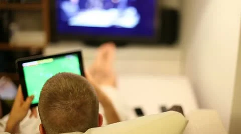 A boy on sofa with tablet Stock Footage 11236099