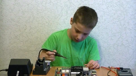 Boy solder elecrtonic chip Stock Footage 62480994