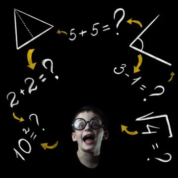 Boy solve mathematics examples at the blackboard Photos