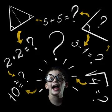 Boy solve mathematics examples at the blackboard Stockfoto's