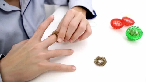 Boy solves a puzzle at the table Stock Footage 323164463