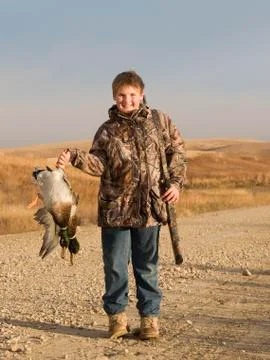 Boy with some Mallards after a quick hunt on the prairie Stock Photos