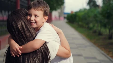Boy son hugging mother, happy face of boy child, mother and son, woman hugging Stock Footage 302473083