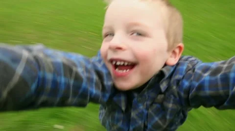 Boy spinning around Stock Footage 11024048