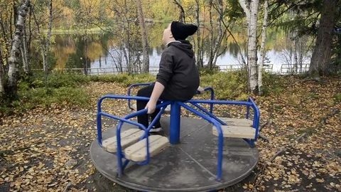 The boy spins on the carousel Stock Footage 80301142