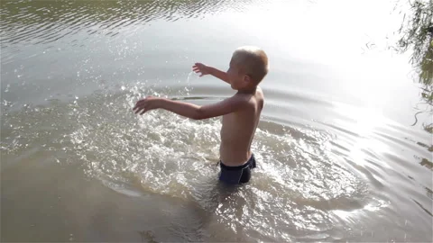 Boy Splashing In Water Stock Footage 87115185