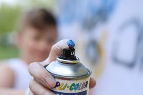 Boy with spray 스톡 사진