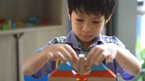 Boy stacking blocks Stock Footage 52897966