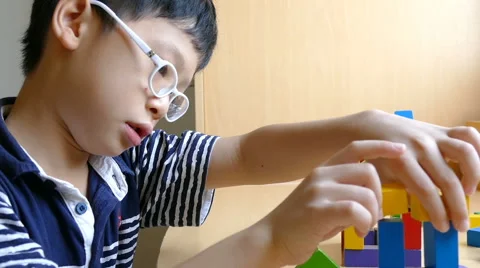 Boy stacking blocks Stock Footage 63654400