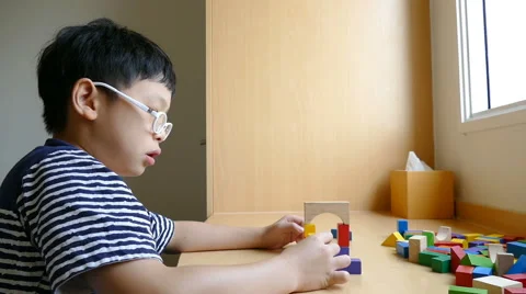 Boy stacking blocks Stock Footage 63654405