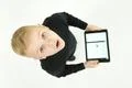 The boy stand with a laptop. View from above Photo