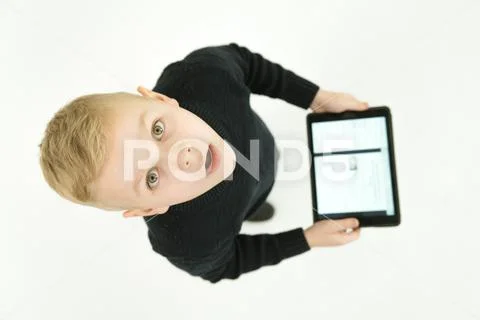 The boy stand with a laptop. View from above Stock Photos