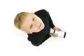 The boy stand with a smartphone. View from above Photo