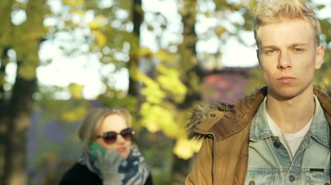 Boy standing and looking to the camera in the park 스톡 동영상 57800148