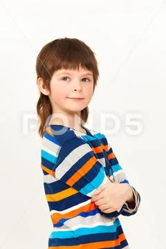 Boy standing confidently with his arms folded Stock Photos