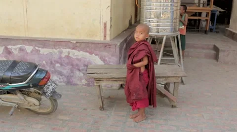 Boy standing in front of bench Stock Footage 48733860
