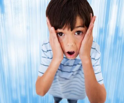 Boy standing looking scared Stock Photos