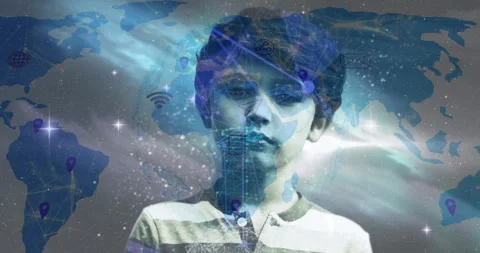 Boy standing neutral gray activating world map and icons linking data nodes for Stock Footage 313771397