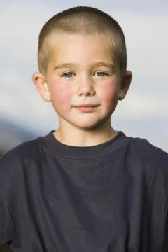 Boy standing outside Stock Photos