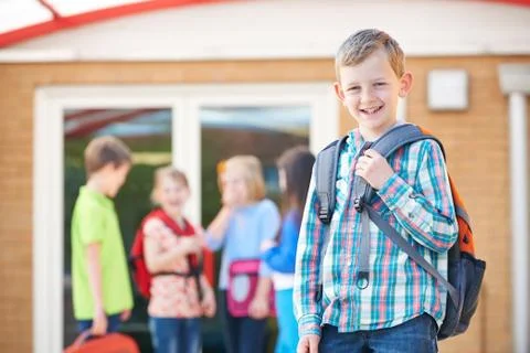 Boy Standing Outside School Classroom With Rucksack Stock Photos