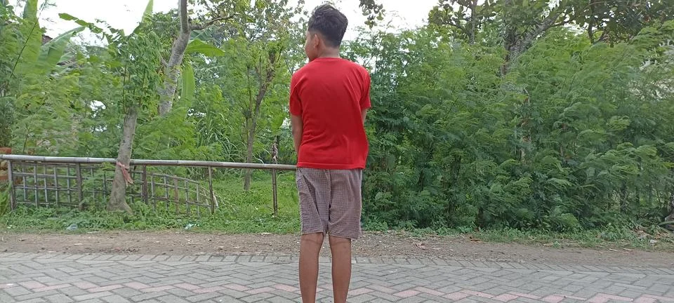 A BOY STANDING Foto stock